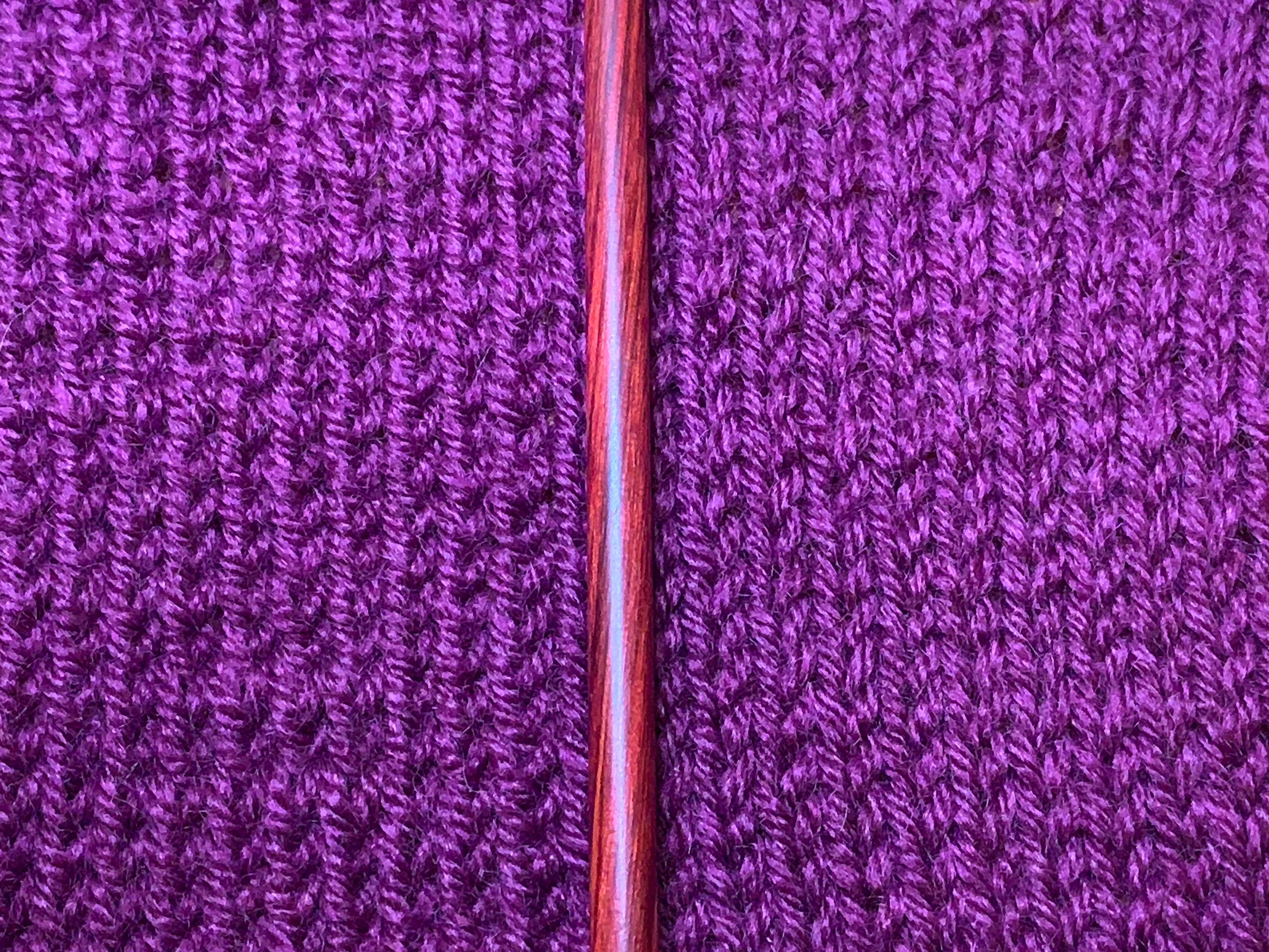 A comparison of normal stockinette stitch (right) with twisted stockinette (left).