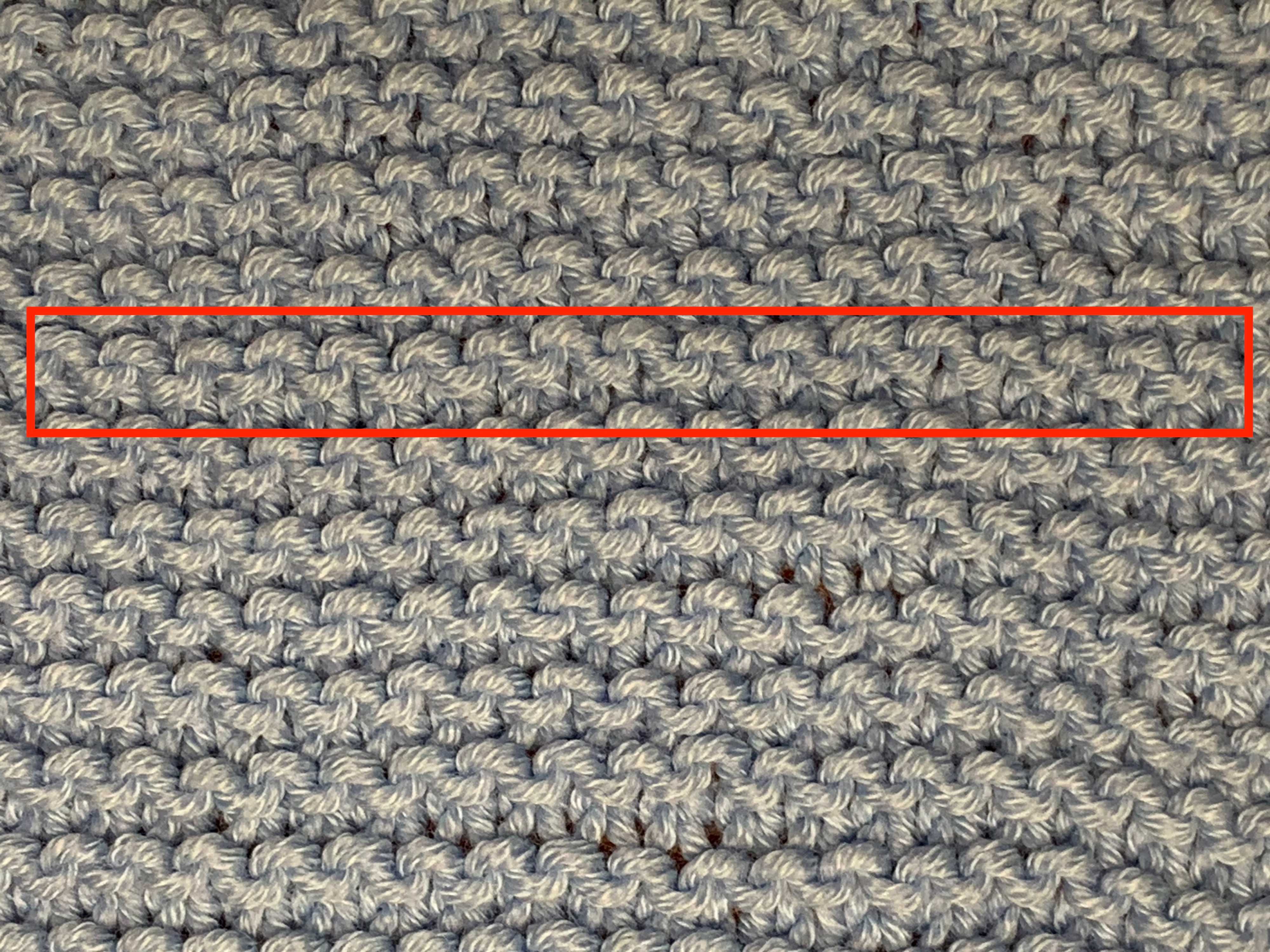 Garter stitch. A single garter ridge, formed of two rows of knits, is marked in red.